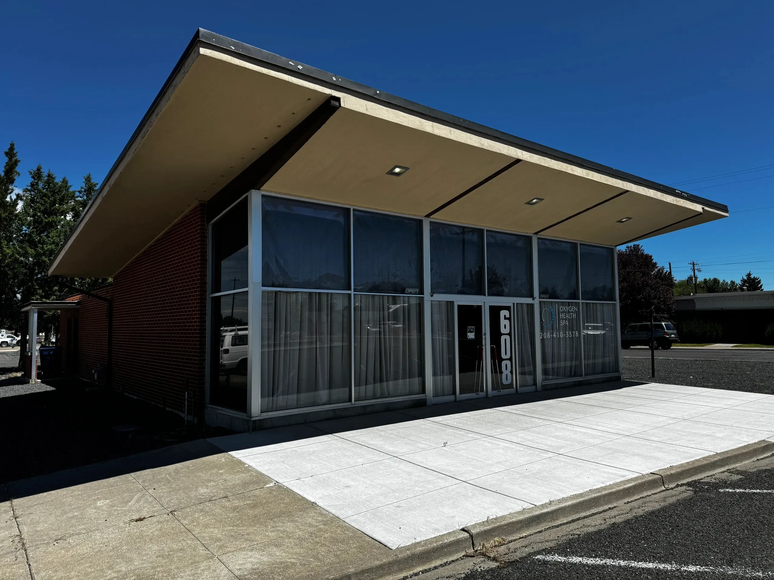 Modern glass-fronted building with flat roof