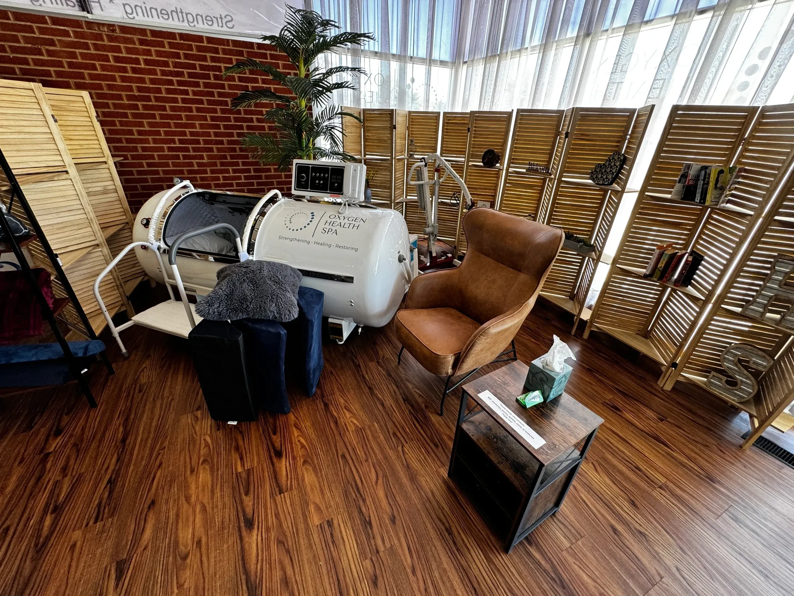 Wooden-floored room with hyperbaric chamber