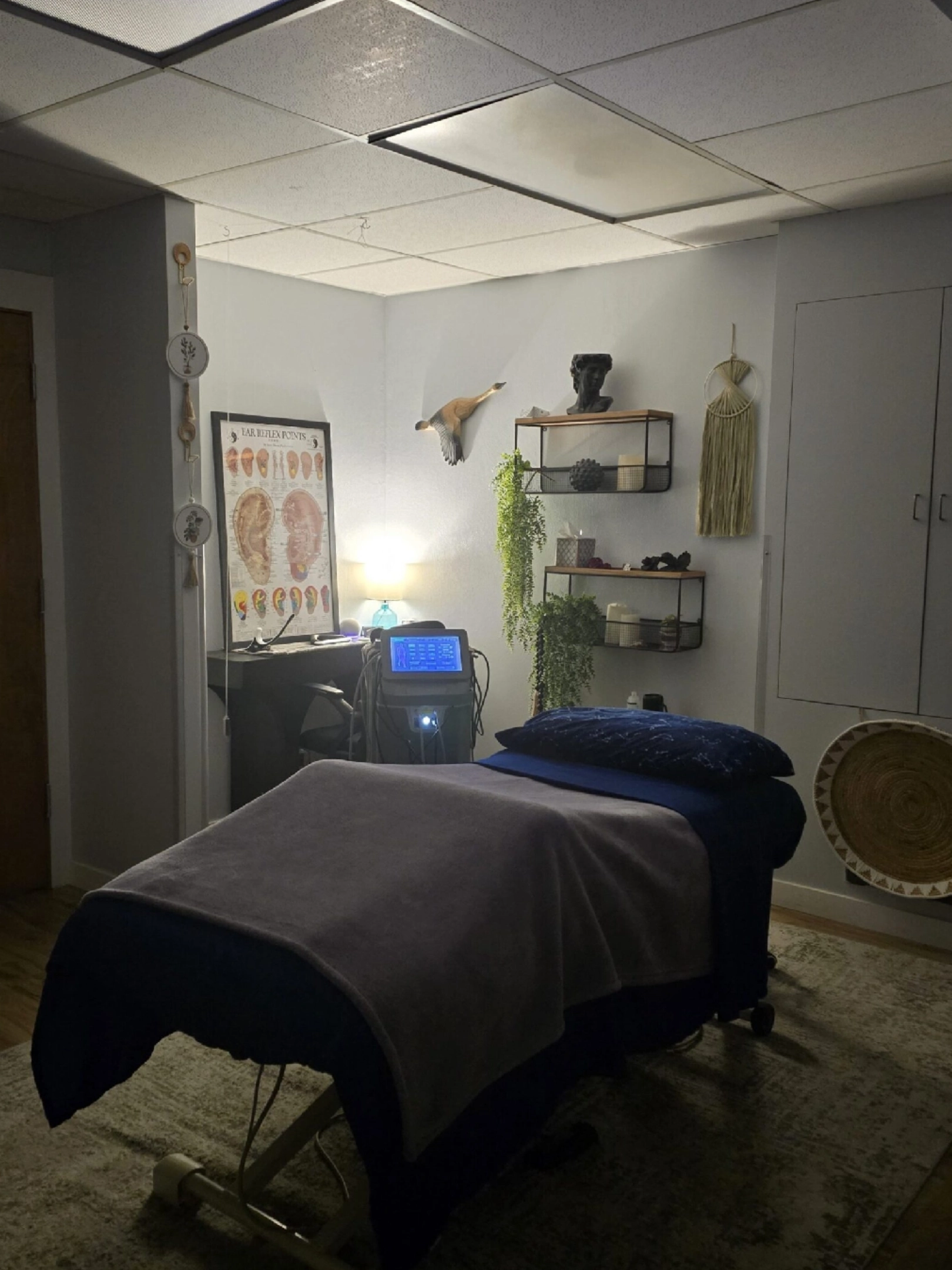 Cozy massage therapy room with treatment table